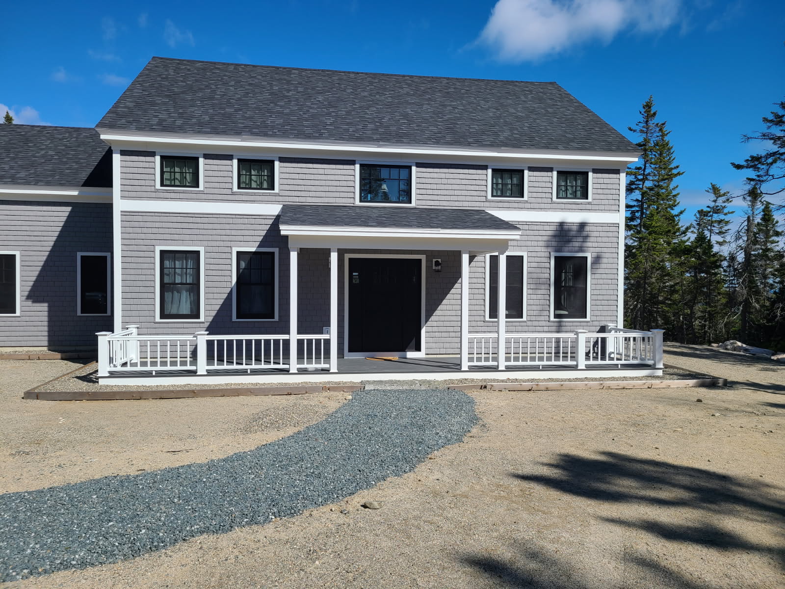 Front entrance of a new home built by L.E. Nichols & Son LLC — Harrington, ME
